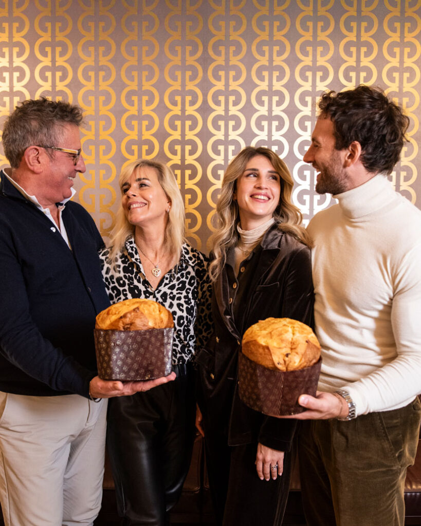 Quarta e quinta generazione della famiglia Graziati con panettoni artigianali della storica pasticceria di Padova